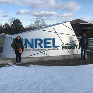 SFIS Doctoral Students Yiamar Rivera-Matos and Angel Echevarria with the NREL sign in Golden, Colorado. SFIS Doctoral Students Yiamar Rivera-Matos and Angel Echevarria pose in front of the NREL sign in Golden, Colorado.