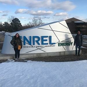 SFIS Doctoral Students Yiamar Rivera-Matos and Angel Echevarria pose in front of the NREL sign in Golden, Colorado.