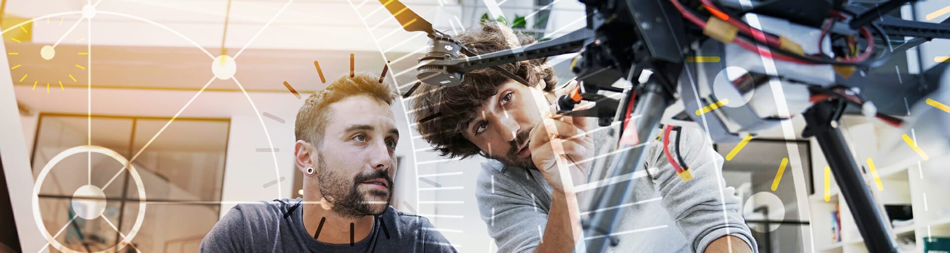 researchers looking at a drone