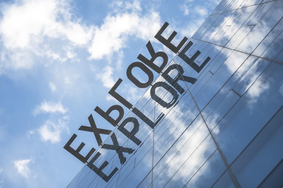 A building with glass windows and blue sky