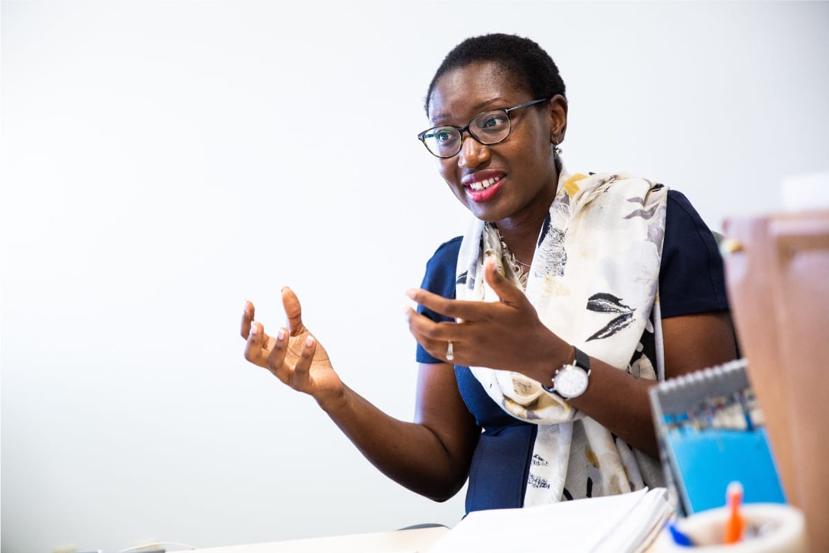 A person is delivering a speech to a room with people